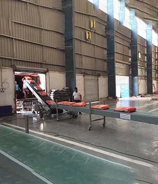 Horizontal mover with truck loading conveyor