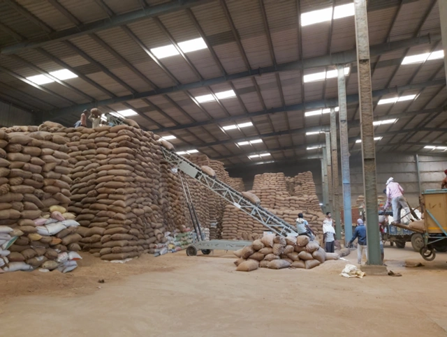 High bag stacker for stacking paddy bags
